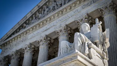 A summer day in front of the US Supreme Court Building in Washington, DC.